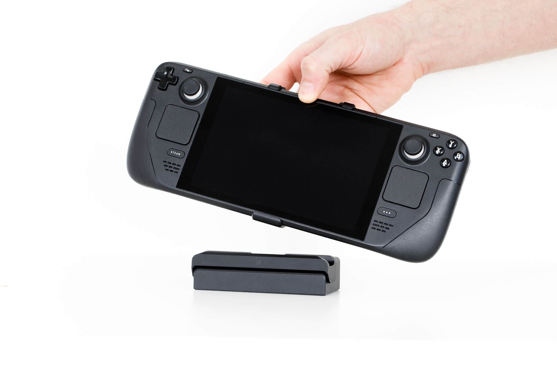 The Mechanism Steam Deck Dock Adapter allows you to use your Steam Dock as usual while your Deckmate Grip is attached.