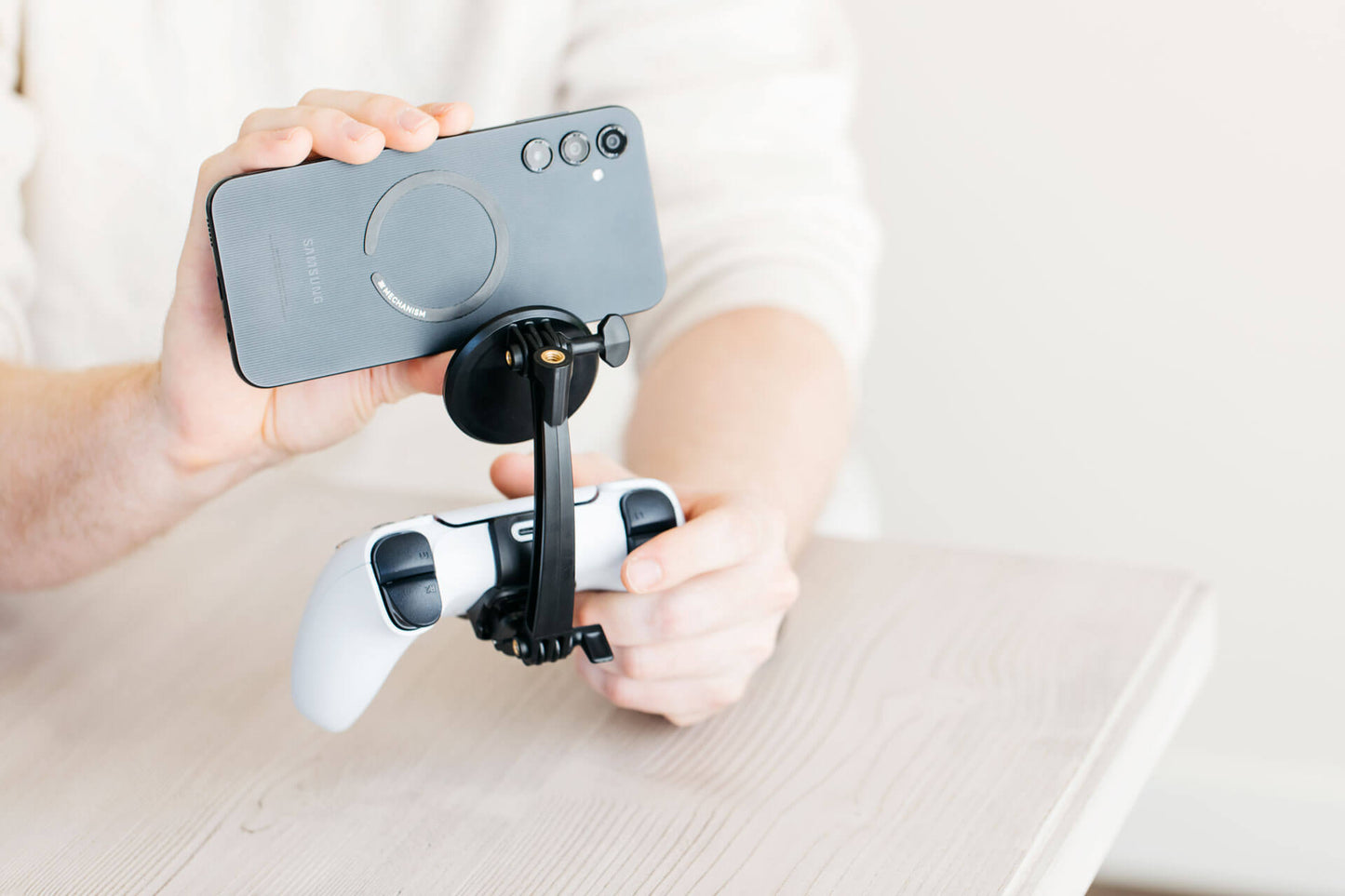 Attach any phone to your PS5 controller using the Mechanism PS5 Controller Grip and the Mechanism Phone Mount.