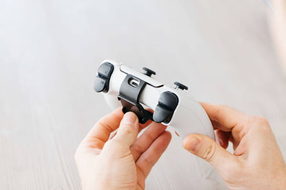 The Mechanism PS5 Controller Grip clips on without interfering with the trackpad or any other functionality. 