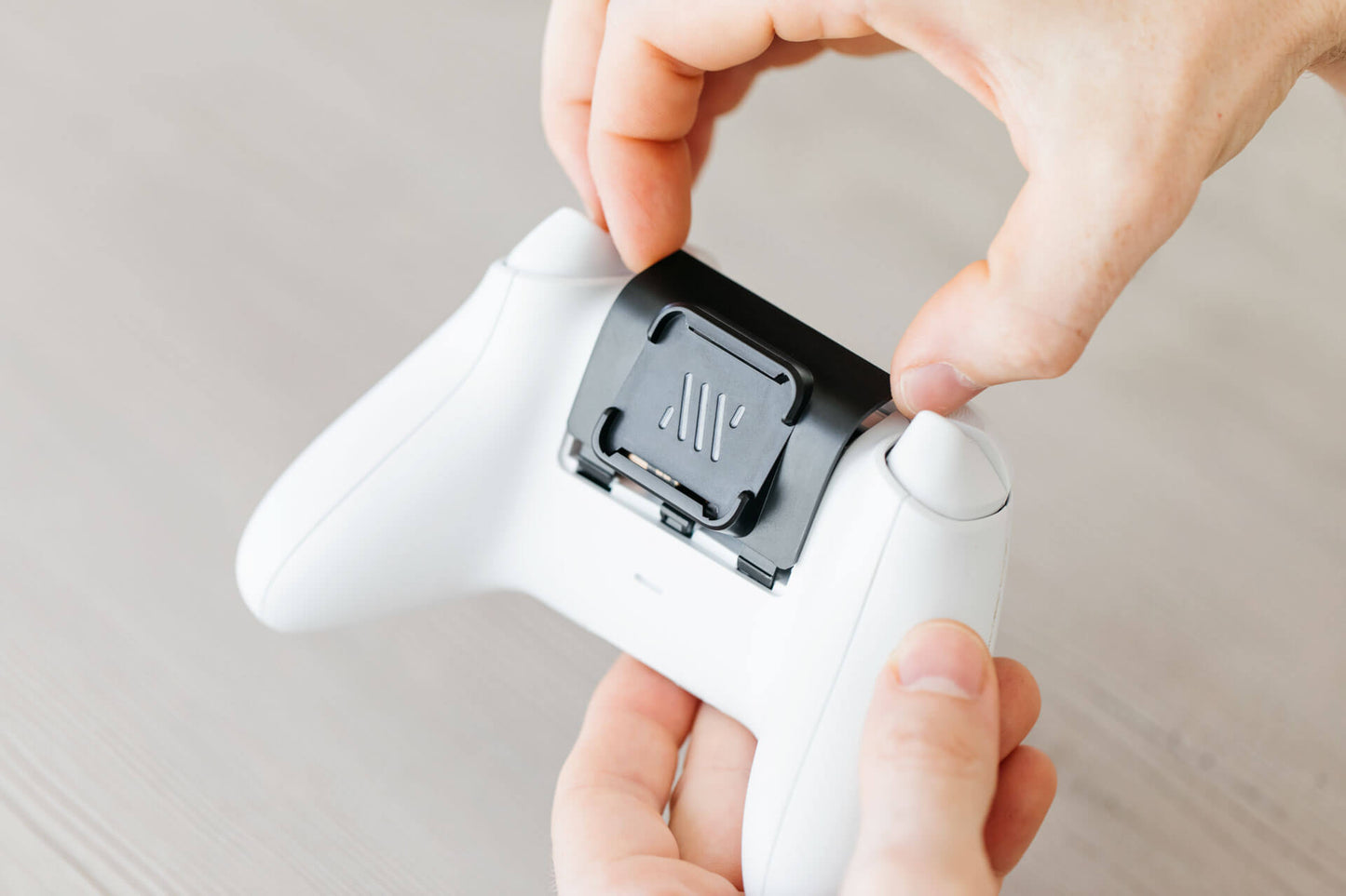 The Mechanism Xbox Controller Grip slots directly in to the battery cover.