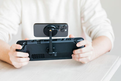 The Mechanism Phone Mount attaches a phone above the screen of a Steam Deck 